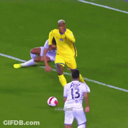 A Soccer Player With The Number 13 On His Jersey Is Kicking The Ball GIF