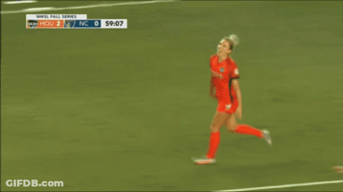 A Soccer Player With The Number 14 On Her Jersey Hugging Another Player GIF