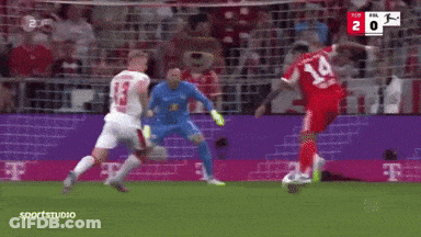 A Soccer Player With The Number 14 On His Jersey Is Kicking The Ball GIF