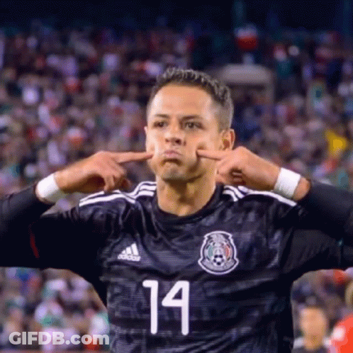 A Soccer Player With The Number 14 On His Jersey Making A Funny Face GIF
