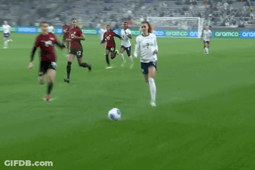 A Soccer Player With The Number 14 On His Shorts Is Falling On The Ground GIF