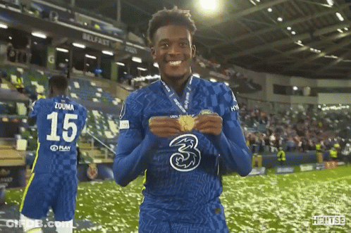 A Soccer Player With The Number 15 On His Jersey Is Holding A Medal GIF