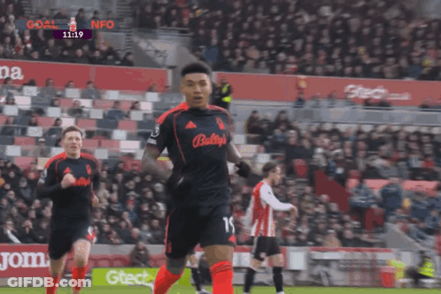 A Soccer Player With The Number 15 On His Jersey Is Running GIF