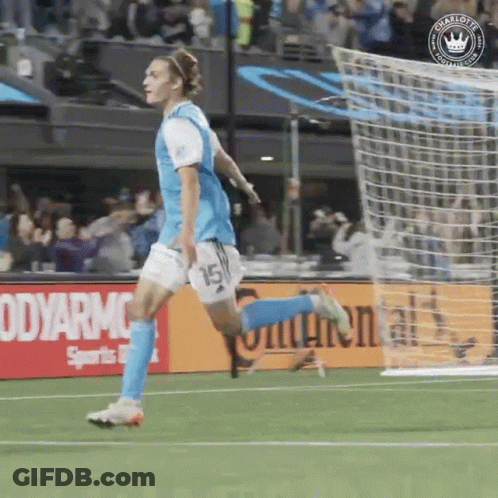 A Soccer Player With The Number 15 On His Shorts Is Running On The Field GIF
