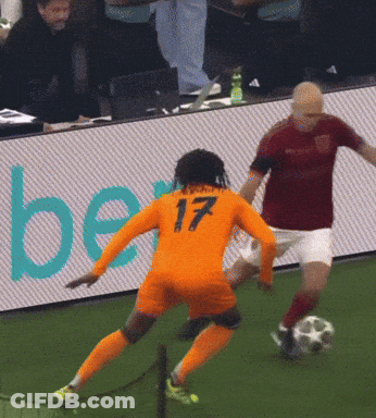A Soccer Player With The Number 17 On His Jersey Kicks The Ball GIF