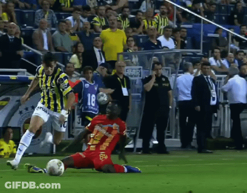 A Soccer Player With The Number 18 On His Jersey Is Kicking The Ball GIF
