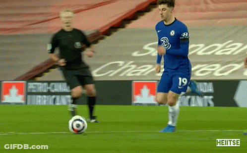 A Soccer Player With The Number 19 On His Jersey Is Kicking A Ball GIF