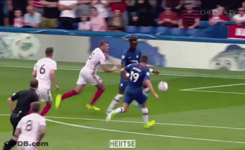 A Soccer Player With The Number 19 On His Jersey Kicks The Ball GIF