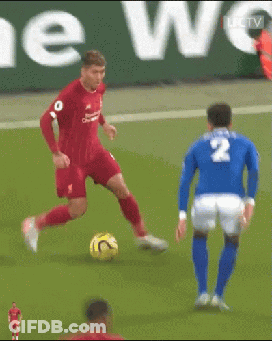A Soccer Player With The Number 2 On His Jersey Is Dribbling The Ball GIF