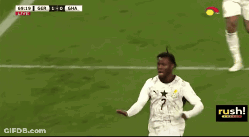 A Soccer Player With The Number 2 On His Jersey Stands On The Field GIF