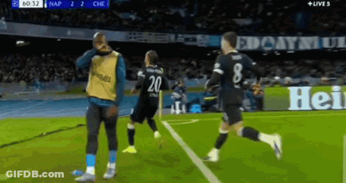 A Soccer Player With The Number 20 On His Back Is Running On The Field GIF