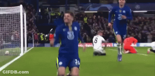 A Soccer Player With The Number 20 On His Jersey Celebrates A Goal GIF