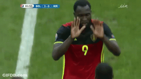 A Soccer Player With The Number 20 On His Jersey Hugs Another Player GIF