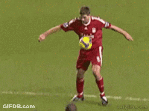 A Soccer Player With The Number 21 On His Back Kicks Another Player GIF