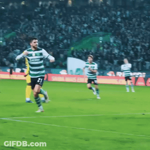 A Soccer Player With The Number 21 On His Jersey Is Running On The Field GIF