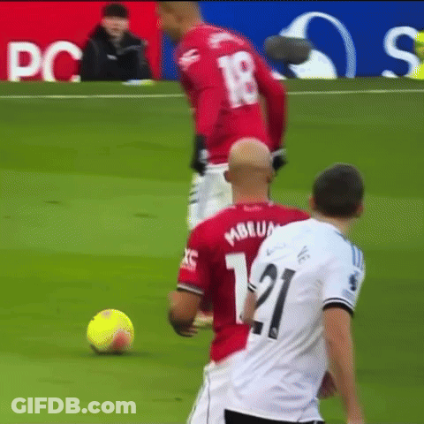 A Soccer Player With The Number 21 On His Jersey Kicks The Ball GIF