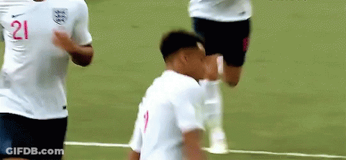 A Soccer Player With The Number 21 On His Shirt Is Standing On A Field . GIF