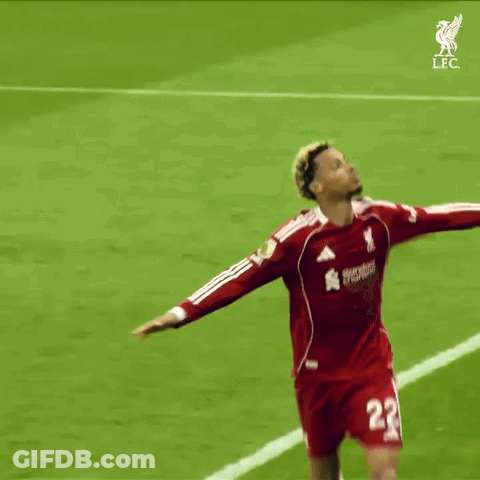 A Soccer Player With The Number 22 On His Jersey Reaches Up Towards The Sky GIF