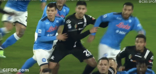 A Soccer Player With The Number 22 On His Shorts Is Being Tackled By Other Players GIF