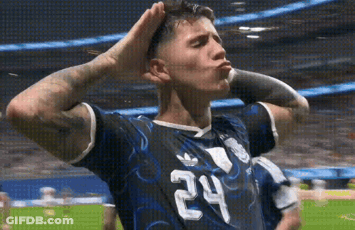 A Soccer Player With The Number 24 On His Jersey Is Blowing A Kiss GIF