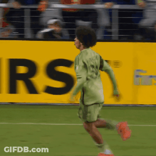 A Soccer Player With The Number 24 On His Jersey Is Running On The Field GIF