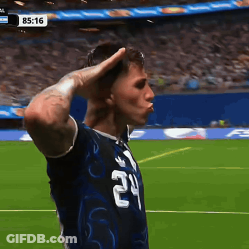 A Soccer Player With The Number 24 On His Shirt Salutes GIF