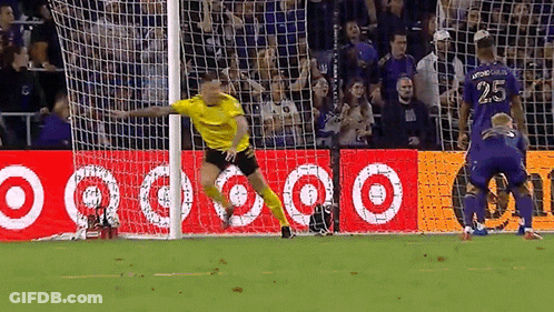 A Soccer Player With The Number 25 On His Jersey Is Jumping In The Air GIF