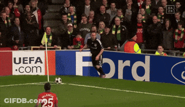 A Soccer Player With The Number 25 On His Jersey Is Kicking A Ball GIF