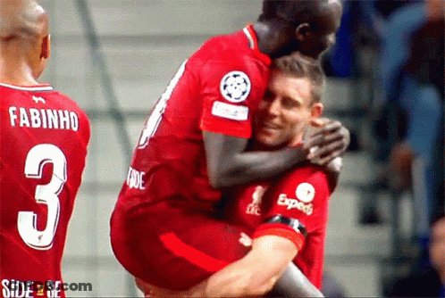 A Soccer Player With The Number 3 On His Back Is Hugging Another Player GIF