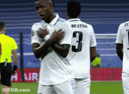 A Soccer Player With The Number 3 On His Jersey Is Talking To Another Player GIF