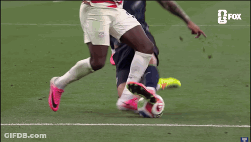A Soccer Player With The Number 3 On His Shirt Is Being Tackled By Another Player GIF