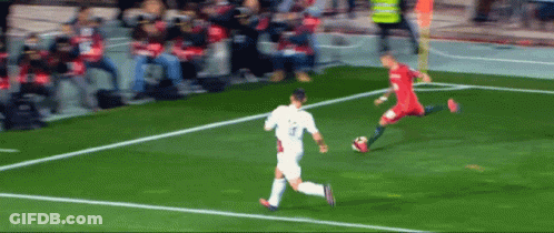 A Soccer Player With The Number 3 On His Shirt Is Kicking The Ball GIF