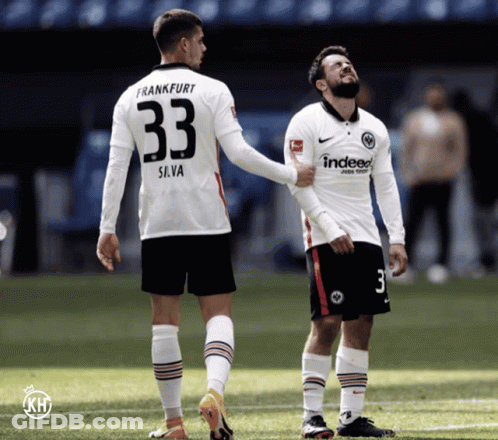 A Soccer Player With The Number 33 On His Back Talks To Another Player GIF