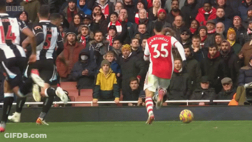 A Soccer Player With The Number 35 On His Back Kicks The Ball GIF