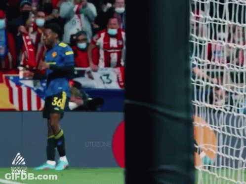 A Soccer Player With The Number 36 On His Jersey Stands On The Field . GIF