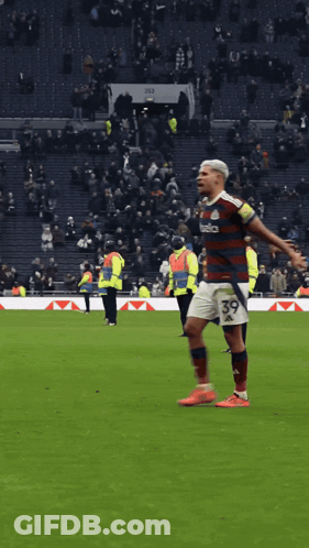 A Soccer Player With The Number 39 On His Shorts Is Standing On The Field GIF
