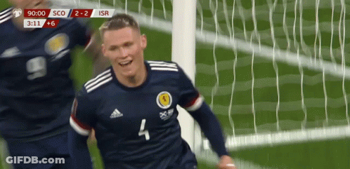 A Soccer Player With The Number 4 On His Jersey Is Celebrating A Goal GIF