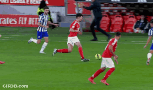 A Soccer Player With The Number 4 On His Jersey Is Kicking A Ball GIF