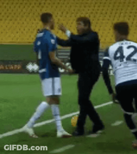 A Soccer Player With The Number 42 On His Jersey Talks To Another Player GIF
