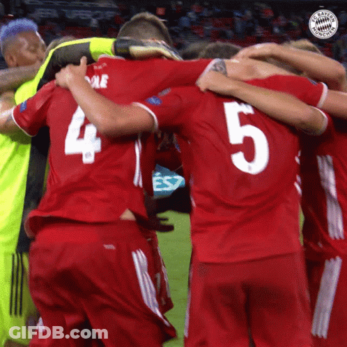 A Soccer Player With The Number 5 On His Back Is Hugging His Teammates GIF