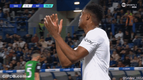 A Soccer Player With The Number 5 On His Jersey Applauds The Crowd GIF