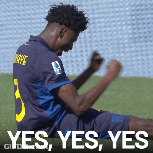 A Soccer Player With The Number 5 On His Jersey Is Laying On The Grass GIF