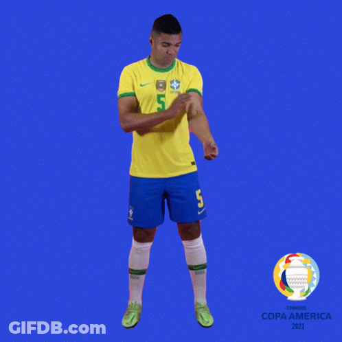 A Soccer Player With The Number 5 On His Jersey Stands In Front Of A Blue Background GIF
