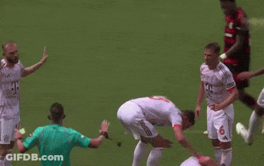 A Soccer Player With The Number 6 On His Jersey Is Laying On The Ground GIF
