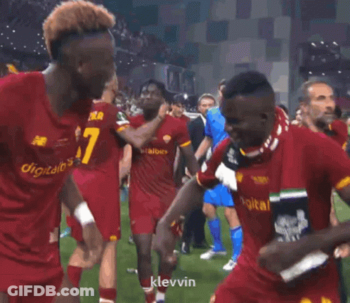 A Soccer Player With The Number 6 On His Shorts Is Dancing With His Teammates GIF