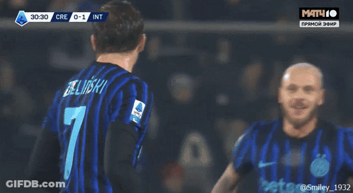 A Soccer Player With The Number 7 On His Back Is Hugging His Teammates GIF