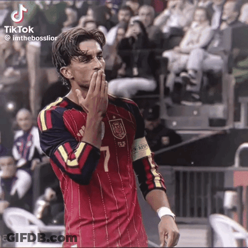 A Soccer Player With The Number 7 On His Jersey Is Blowing A Kiss GIF
