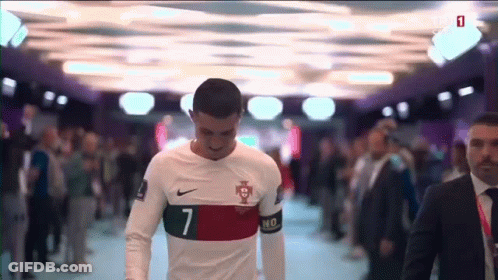 A Soccer Player With The Number 7 On His Jersey Walks Through A Crowd GIF