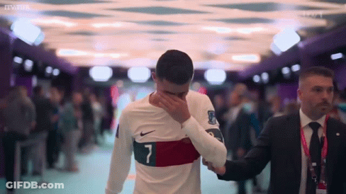 A Soccer Player With The Number 7 On His Shirt Is Covering His Face GIF