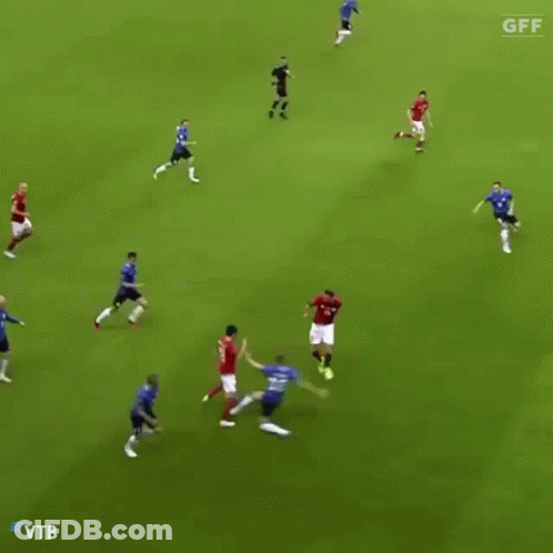A Soccer Player With The Number 8 On His Jersey Is Dribbling The Ball GIF